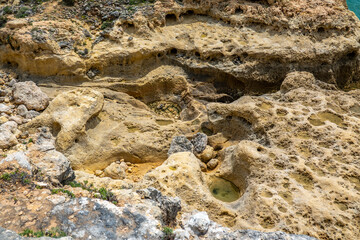 Natural sand formed by erosion of the elements