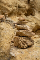 Stacked balanced stones on the cliffs
