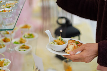 buffet food, catering food party at restaurant, mini canapes, snacks and appetizers
