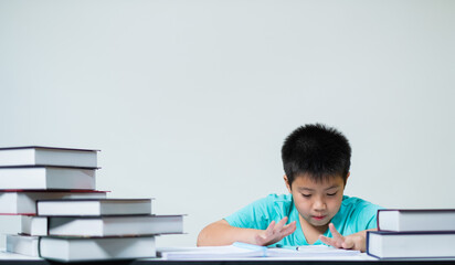 boy doing homework on white background, education concept
