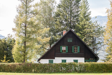 Residential house, a slovenian chalet building, in the middle of a mountain glade, a clearing in a...