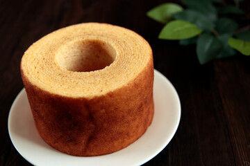 Eating Baumkuchen as a gift at a wedding ceremony at the table at tea time
