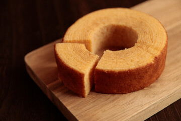 Eating Baumkuchen as a gift at a wedding ceremony at the table at tea time
