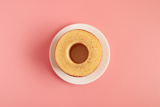 Eating Baumkuchen as a gift at a wedding ceremony at the table at tea time
