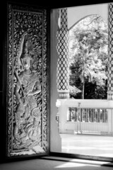 Monochrome door painting  in   Wat Jed Yod buddhist temple, famous landmark of Chiang Mai, Thailand