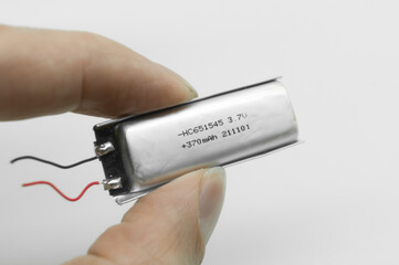Lithium polymer battery on a white background. Compact small lithium battery for micro electronics....