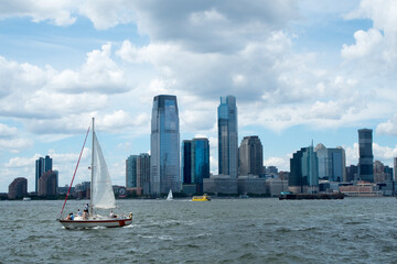 Fototapeta na wymiar Jersey City rises above the Hudson River across from Manhattan