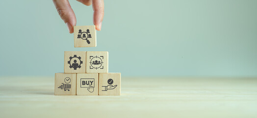 Customer behavior analytics. Marketing concept. Consumer buying decision.  Holding wooden cubes with customer analytics icon standing with consumer behaviors icon; when, how they buy and expectation. - obrazy, fototapety, plakaty