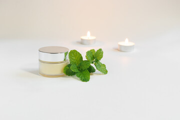 cosmetic jar with balm mint and candles