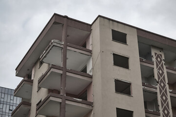 The apartment damaged in the earthquake. The building whose walls were falling in the earthquake.