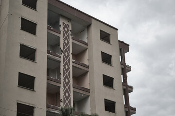 The apartment damaged in the earthquake. The building whose walls were falling in the earthquake.