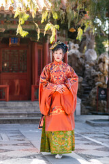 Fototapeta premium Women in classical Chinese costumes in the Forbidden City