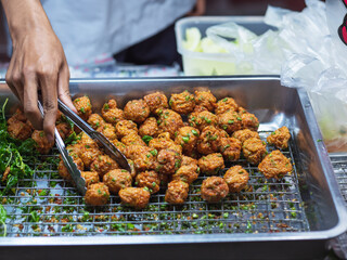 Close-up spicy thai fish cake, Thai street food selling in the market.