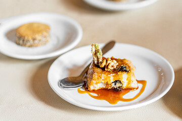 Sticky toffee and quinoa pudding with nuts and raisins. Quinoa is an ancient plant from the Andes mountains used by native people of South America for many centuries.