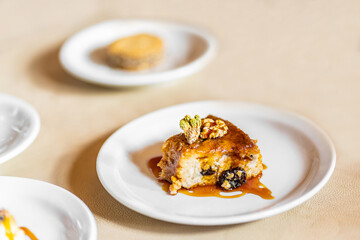 Sticky toffee and quinoa pudding with nuts and raisins. Quinoa is an ancient plant from the Andes mountains used by native people of South America for many centuries.