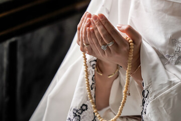 Muslim woman's hand Praying for the blessings of Allah At the mosque in Ayutthaya