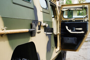 Close up of a green military truck. Modern technologies of military transport equipment
