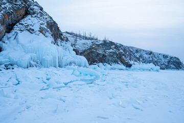 Fototapeta na wymiar Lake Baikal in winter. Panorama of rocks near the island Olkhon from the ice