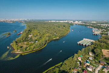 Aerial landscape view on Volga river with islands and green forest. Picturesque panoramic view from the height on the touristic part of the Volga river near Samara city at summer sunny day.