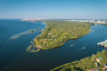 Aerial landscape view on Volga river with islands and green forest. Picturesque panoramic view from the height on the touristic part of the Volga river near Samara city at summer sunny day.
