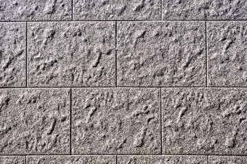 Background from a wall with rectangular grey stone slabs