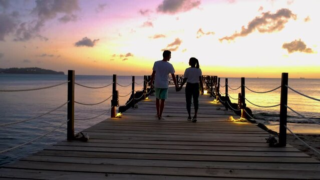 St Lucia Caribbean, couple men and women on vacation,Huge pitons drone view at Saint Lucia sugar beach St Lucia mountains at the beach with clear ocean