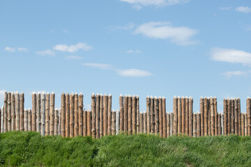 Wooden fence against the sky, the protection of the fortress.