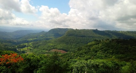 Fototapeta na wymiar landscape with clouds: green mountains, blue sky, nature - gramado, rio grande do sul, brazil