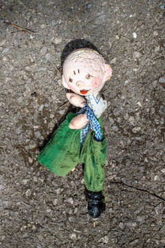 old rag dolls lie on the ground