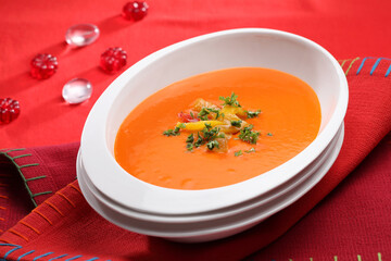 Yellow Pepper Soup on a red base.