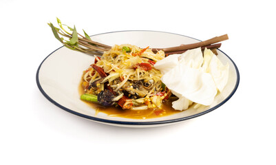 Thai food, papaya salad, or som tam decorated with morning glory on a plate isolated on white background