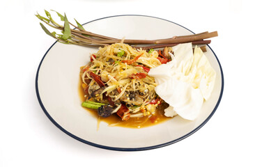 Thai food, papaya salad, or som tam decorated with morning glory on a plate isolated on white background