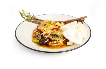 Thai food, papaya salad, or som tam decorated with morning glory on a plate isolated on white background