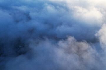 Sun is rising above the Clouds. fast moving clouds. drone's footage