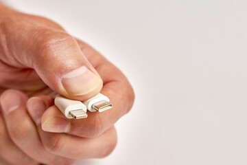 Hold the USB  Lightning and USB C, USB connectors in your hand