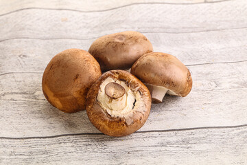 Raw brown champignons mushroom heap