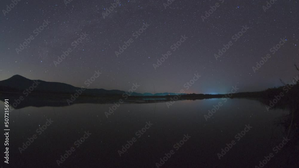 Wall mural beautiful winter scene in timelapse video 4k with mountains in the background. the southern star tra