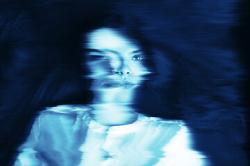 Fantasy, illusion and sci-fi concept. Abstract beautiful woman portrait in blue neon futuristic...