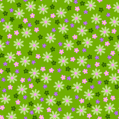 Cute floral Ditsy fashion trend pattern with small delicate flowers isolated on a green background