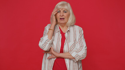Sincere woman 70s years old in shirt wishing, waiting for good luck and loses becoming surprised...