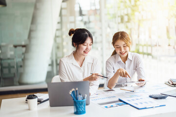 Negotiation, Analysis, Discussion: Portrait of an Asian female economist and marketer using tablet...