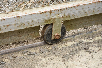 Old used aged weathered sliding gate roller. 