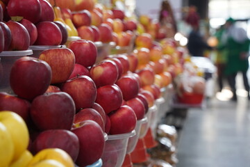 Almaty, Kazakhstan - 03.25.2022 : Sale of apples of different varieties on the open market.