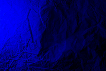 Colored background is dark blue, with a crumpled surface texture