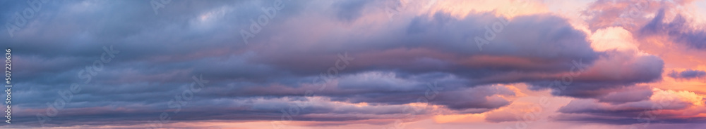 Wall mural clouds in evening dusk sky panoramic view. climate, environment and weather concept sky background.