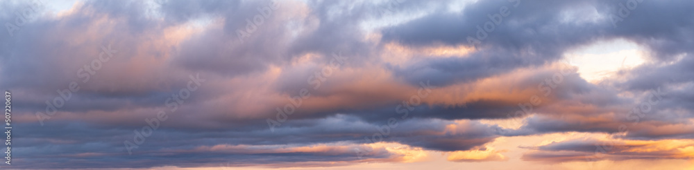 Wall mural clouds in evening dusk sky panoramic view. climate, environment and weather concept sky background.