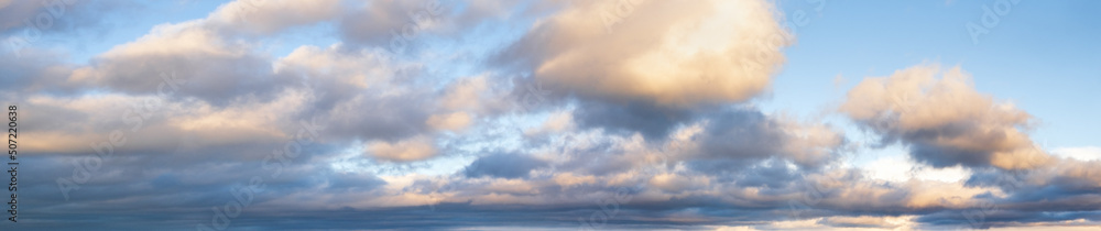 Wall mural clouds in evening dusk sky panoramic view. climate, environment and weather concept sky background.