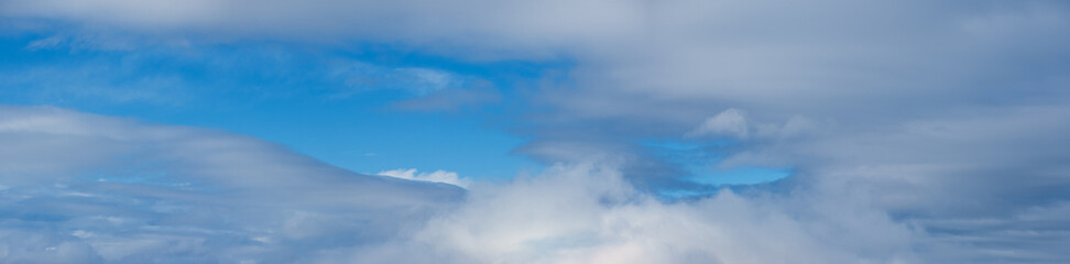 White clouds in blue summer sky panoramic  background