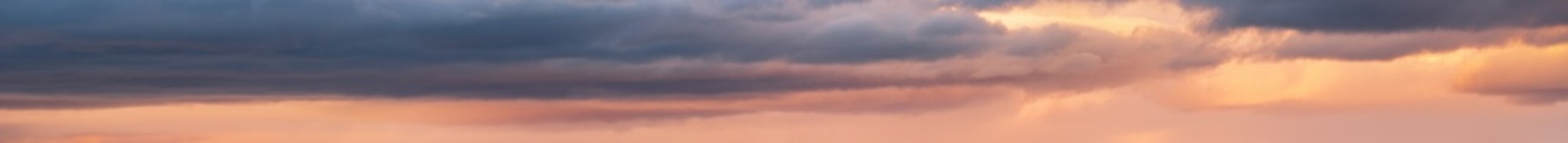 Clouds in evening dusk sky panoramic view. Climate, environment and weather concept sky background.
