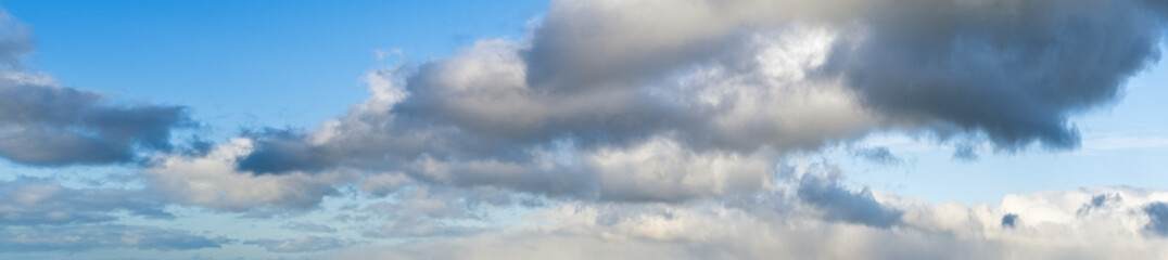 White clouds in blue summer sky panoramic  background